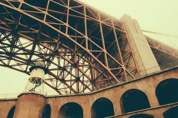 A person using a laptop with a lock icon overlay.